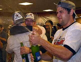 Lance Berkman and his Astros teammates celebrate the wild card