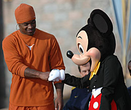 Cedric Benson shakes hands with Mickey